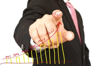Businessman hand write graph isolated on white